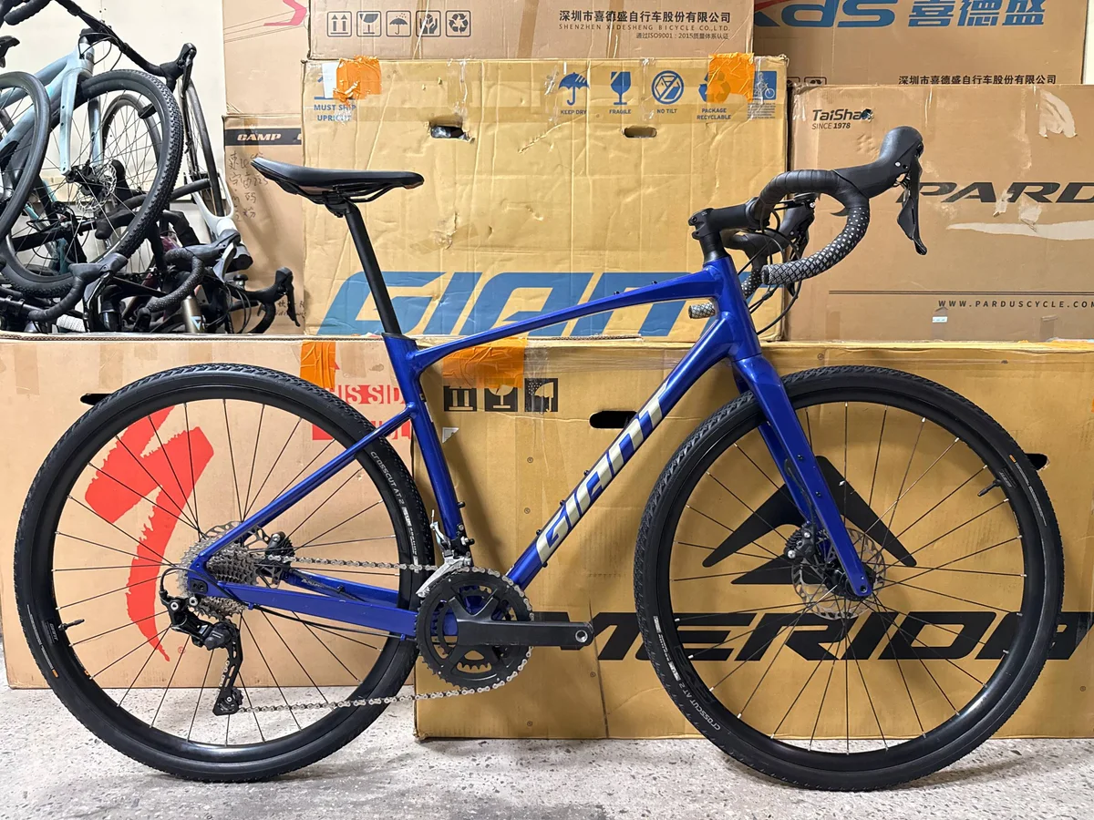 Used Giant Revolt from the OpenCycle ad: blue bike with aluminum wheels, side view